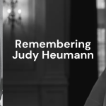 Remembering Judy Heumann. (White text over a dark black and white pair of photos - one of Judy as a younger person advocating for Section 504; on the right, Judy poses for a photo in a darkly lit room from her wheelchair and smiles at the camera